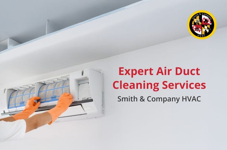 Smith & Company HVAC technician performing professional air duct cleaning services to improve indoor air quality in Maryland and D.C.